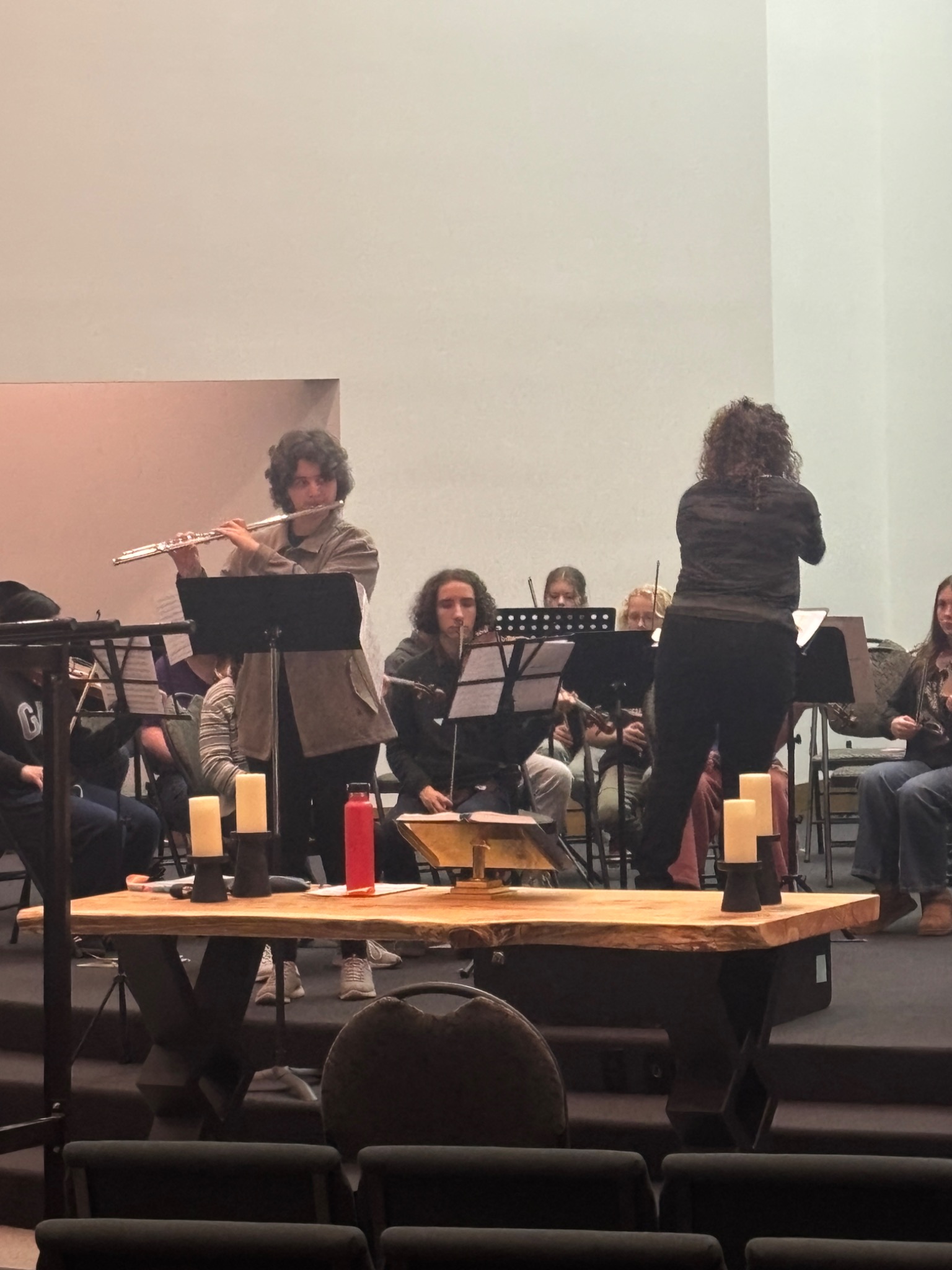 Young flutist performing with an ensemble